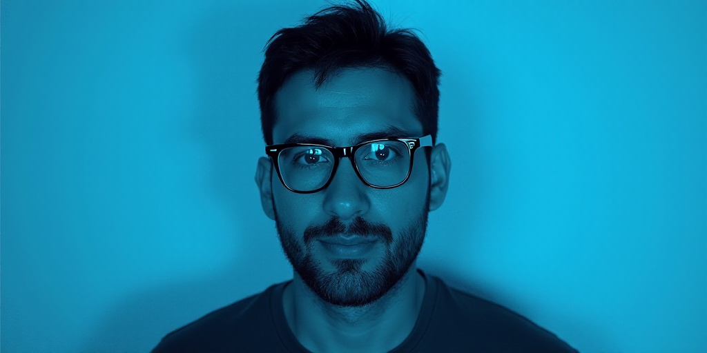 a man with glasses and a blue background with a black and white photo of him and the words, enrique