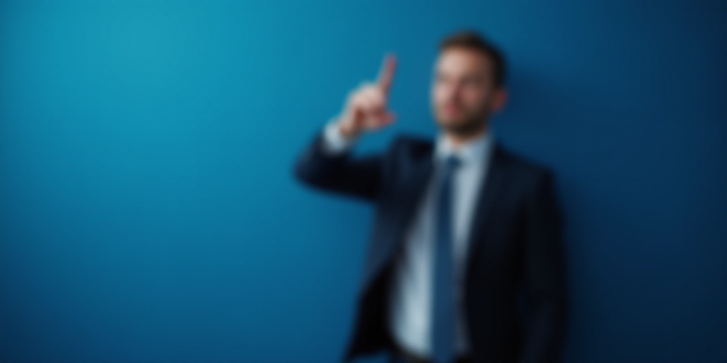 a man in a suit pointing at something with his finger in the air and a blurry background of a blue w