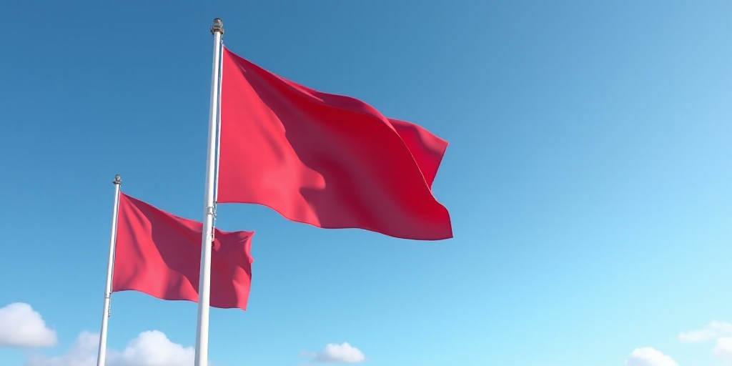 two flags flying in the wind on a clear day with a blue sky in the background and a red one in the f
