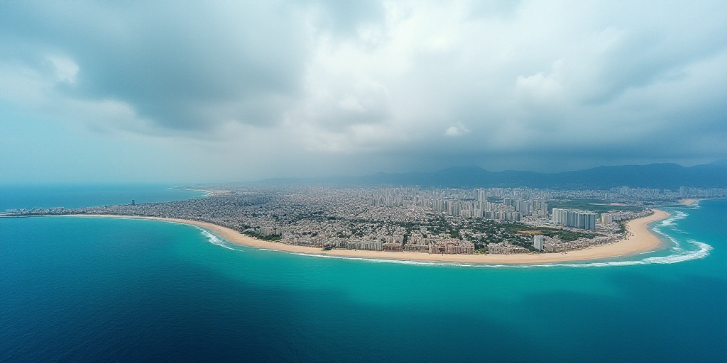 a city on a beach with a blue ocean and a cloudy sky above it and a blue ocean below it, Esaias Bour