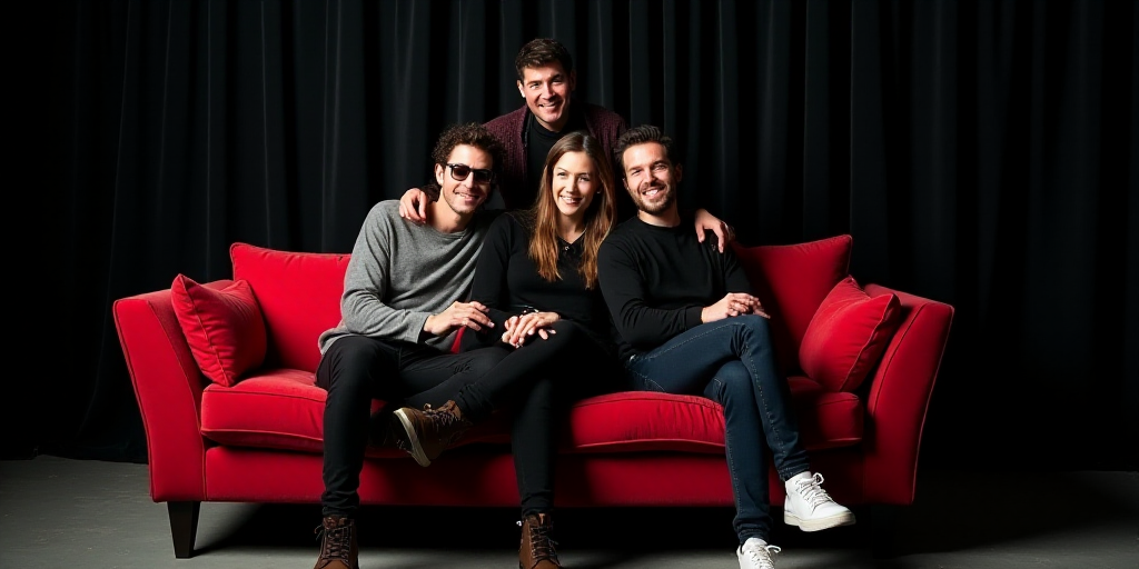 a group of people sitting on top of a red couch next to each other on a black background with a blac