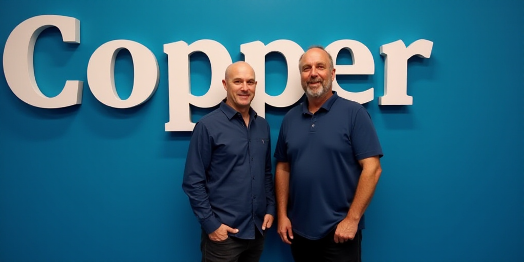 two men standing next to each other in front of a blue background with the words copper on it and a