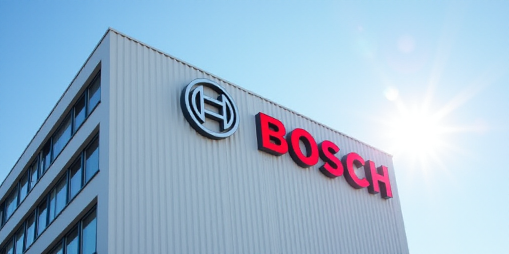 a bosch sign on a building with a blue sky in the background and a white building with a red logo, E