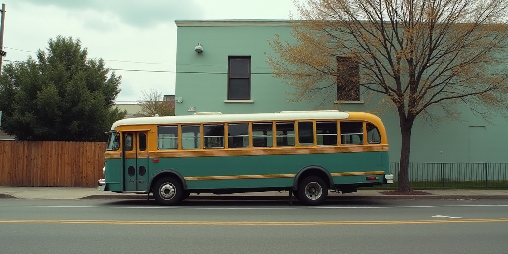 a bus that is sitting in the street next to a building and a fenced in area with a tree, Estuardo Ma