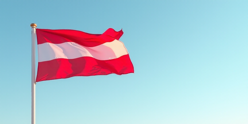 a flag flying in the wind with a blue sky in the background and a red and white stripe on the flag,