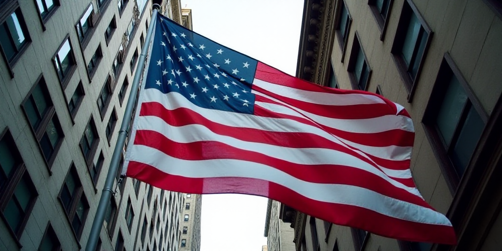 a large american flag is hanging from a building in new york city, usa, on a flagpole, Andries Stock