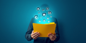 a person holding a yellow folder in their hands with icons coming out of it and a blue background wi