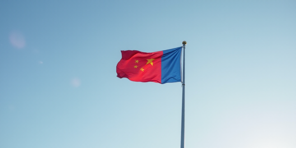 a flag flying high in the sky on a pole with a flag on top of it and a red and blue flag on the pole