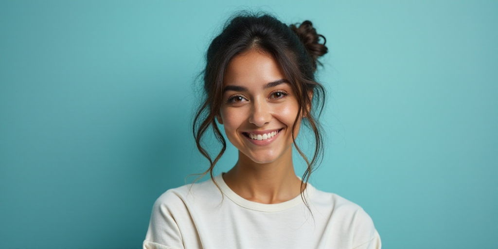 a woman in a white top is smiling for the camera with a blue background and a black and yellow borde